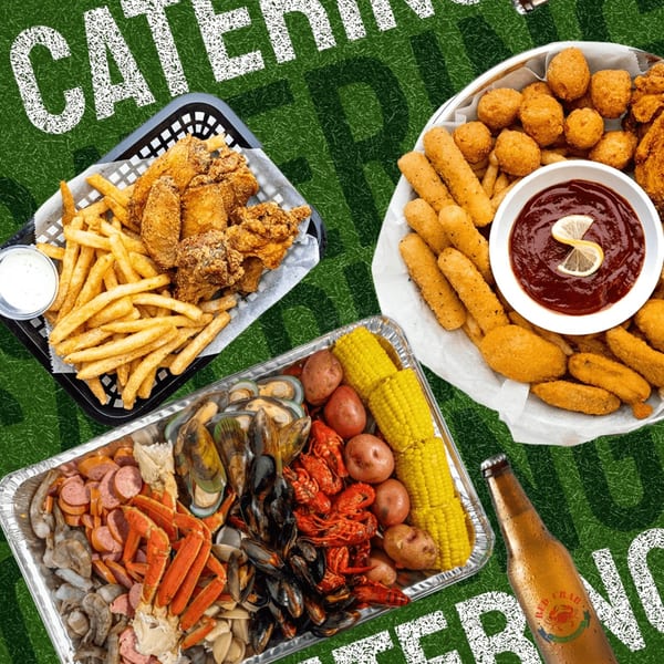 Red Crab Juicy Seafood catering spread with fried chicken, fries, seafood boil, and appetizers.